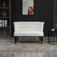 Cream armless loveseat with button-tufted backrest and dark turned wood legs