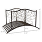 Dark bronze metal garden bridge with arched top, scrollwork side panels, and slatted deck.