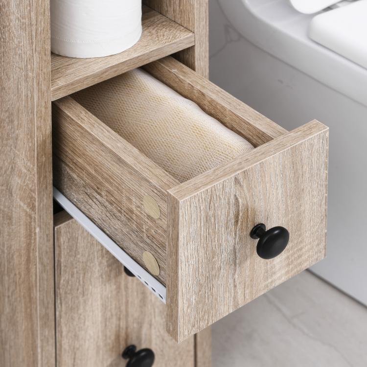 Oak bathroom cabinet drawer with black knob and open storage compartment