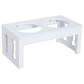 White wooden elevated pet bowl stand with two bowl openings; top view