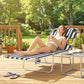 Outdoor tanning chaise lounge with black-and-white striped fabric and adjustable frame
