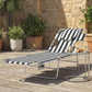 Black-and-white striped tanning chaise lounge chair with face hole and padded head rest
