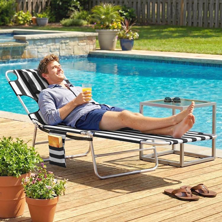 Black-and-white striped adjustable tanning chaise lounge chair with face hole and head pillow
