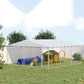 Outdoor dog kennel with silver frame and gray waterproof roof, chain-link sides, large area with toys