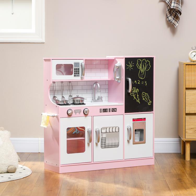 Pink kids play kitchen with stovetop, sink faucet, and black chalkboard door panel