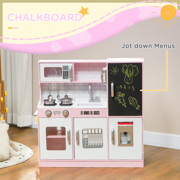 Pink kids pretend play kitchen with black chalkboard and stovetop details