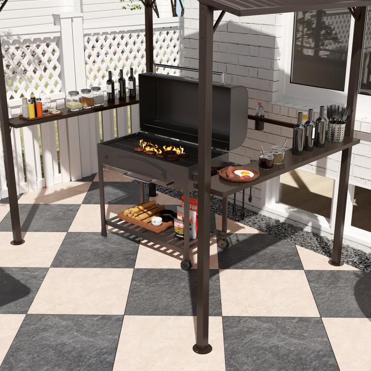 Grill gazebo with side shelves around an open grill, includes tabletop accessories.