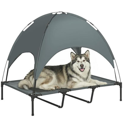 Elevated dog cot with dark gray UV canopy and mesh sleeping surface