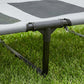 Close-up of elevated dog cot metal frame joint with protective tubing sleeve