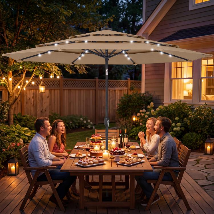 Khaki outdoor table umbrella with solar LED lights overhead over a patio dining area