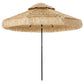 Khaki two-tier thatched patio umbrella with fringed canopy and center pole