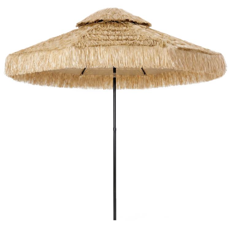 Khaki two-tier thatched patio umbrella with fringed canopy and center pole