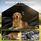Black dog tent shelter with large front opening, dog resting inside on grass