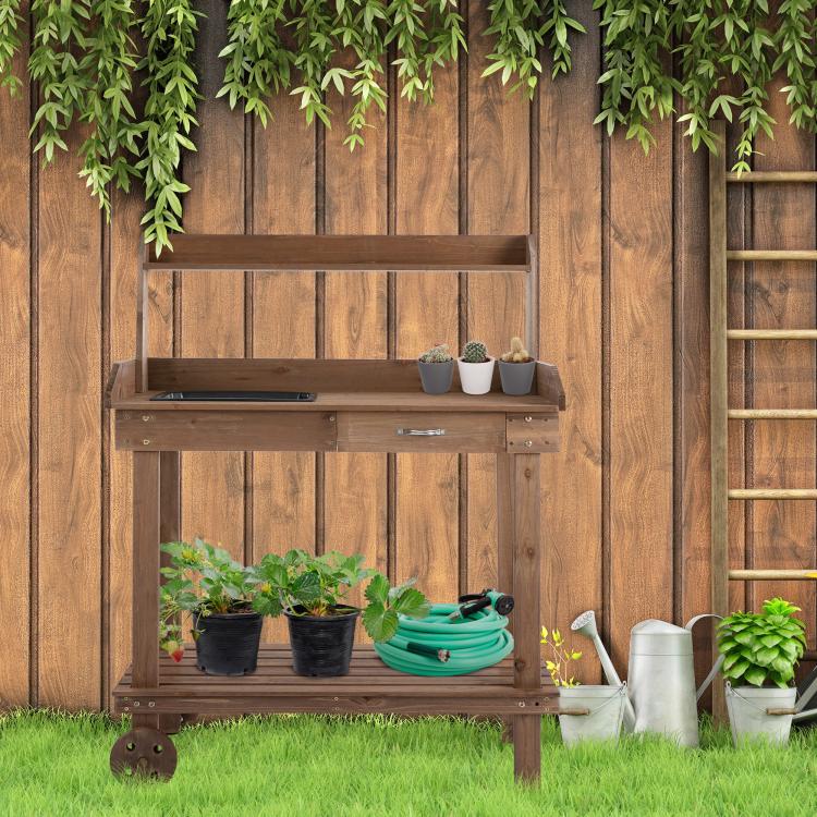 Wood potting bench with sink opening and stacked shelves for plants and tools