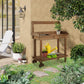 Wooden potting bench with sink opening and two-tier shelf for gardening items