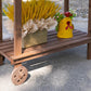 Wood potting bench lower shelf with decorative wheel and potted plants