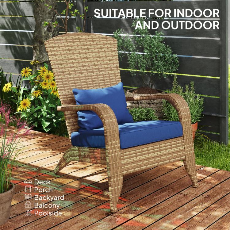 Rattan wicker Adirondack chair with dark blue cushions for indoor or outdoor use