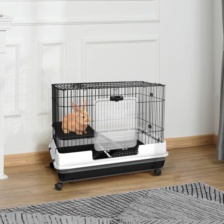 Two-level wire rabbit hutch on wheels with clear divider panel and ramp, black accents