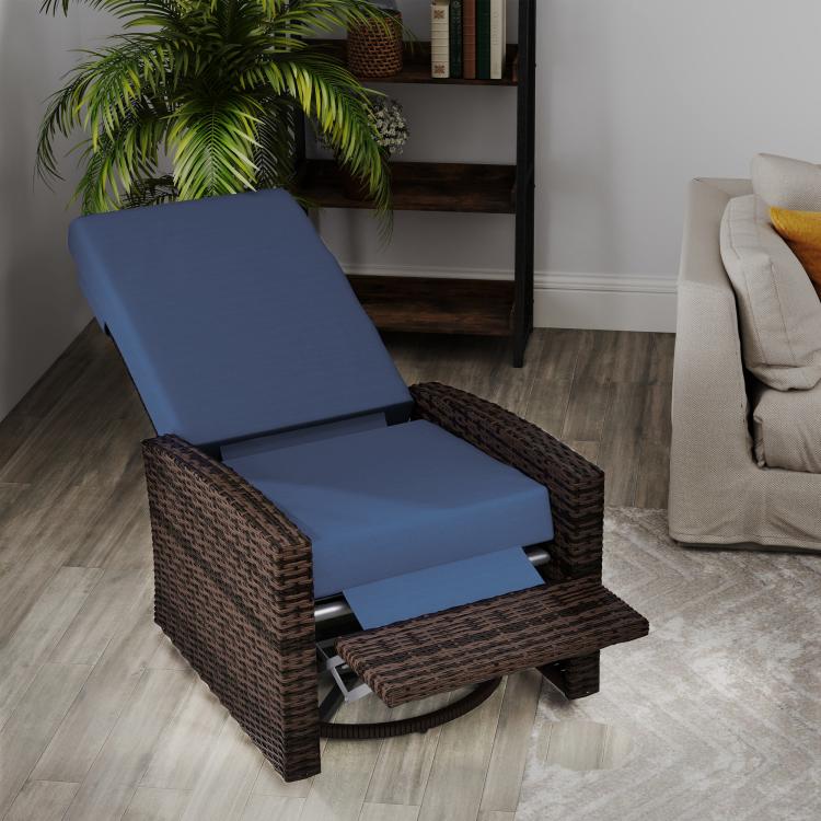 Outdoor wicker swivel recliner chair with dark brown woven base and dark blue cushions, footrest down