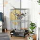 Black wire ferret cage with hanging hammock, woven perch tunnel, and wheeled base