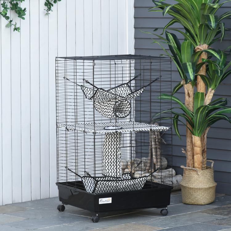 Black metal ferret cage with hammock net, woven tunnel tower, and rolling bottom pan