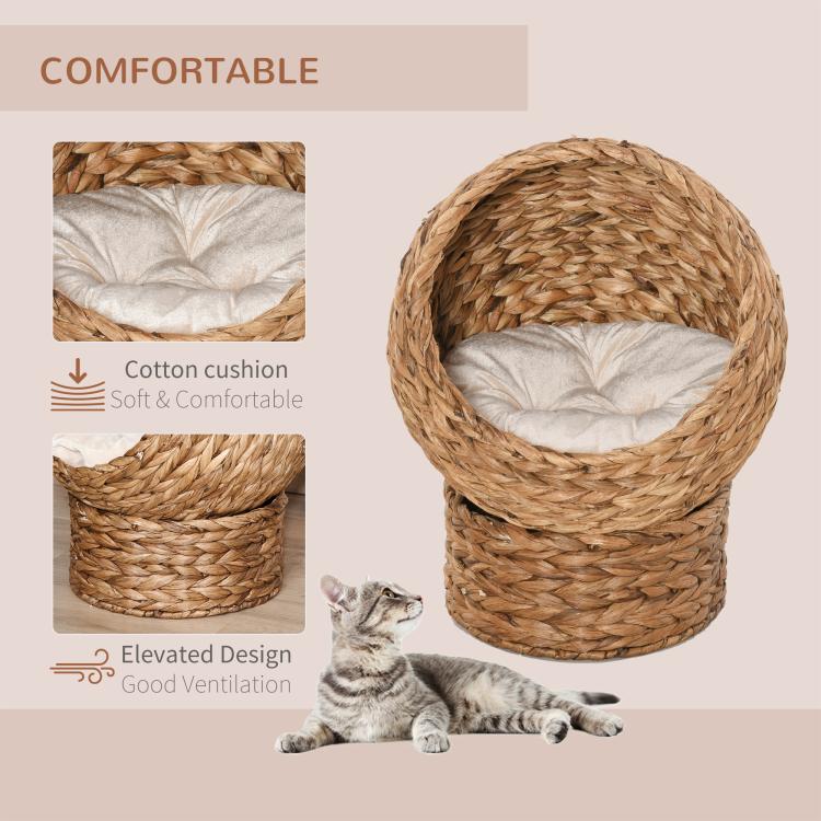 Light brown woven cat dome bed with soft cushion and elevated design shown