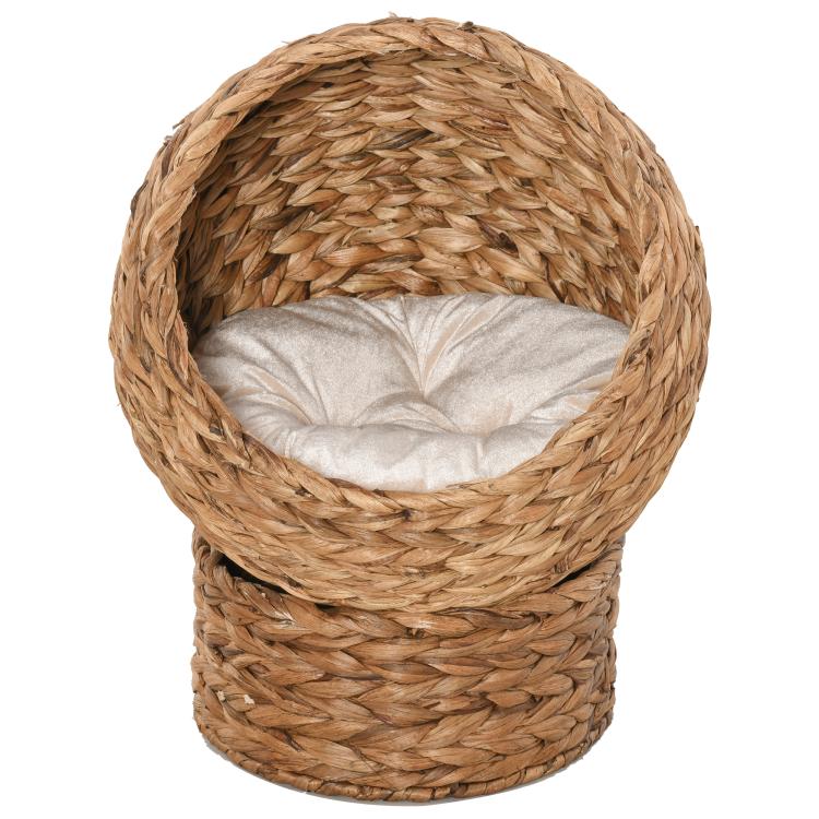 Light brown woven cat dome bed with soft white cushion, front open view