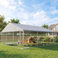 Outdoor chain-link dog run with gray roof and divided play area in backyard