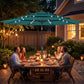 Teal outdoor table umbrella with solar LED lights over backyard dining set