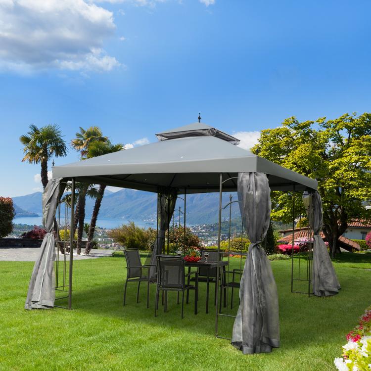 Gray outdoor gazebo canopy with removable mesh curtains and sidewalls, with chairs inside