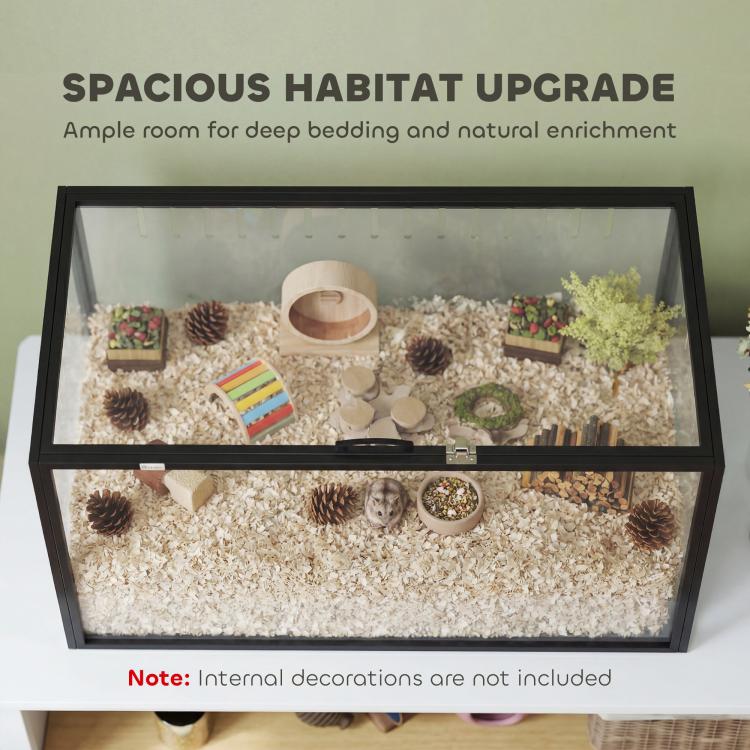 Spacious acrylic pet habitat with black frame, deep bedding, and small accessories