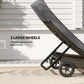 Gray chaise lounge chair showing large wheels and adjustable backrest mechanism