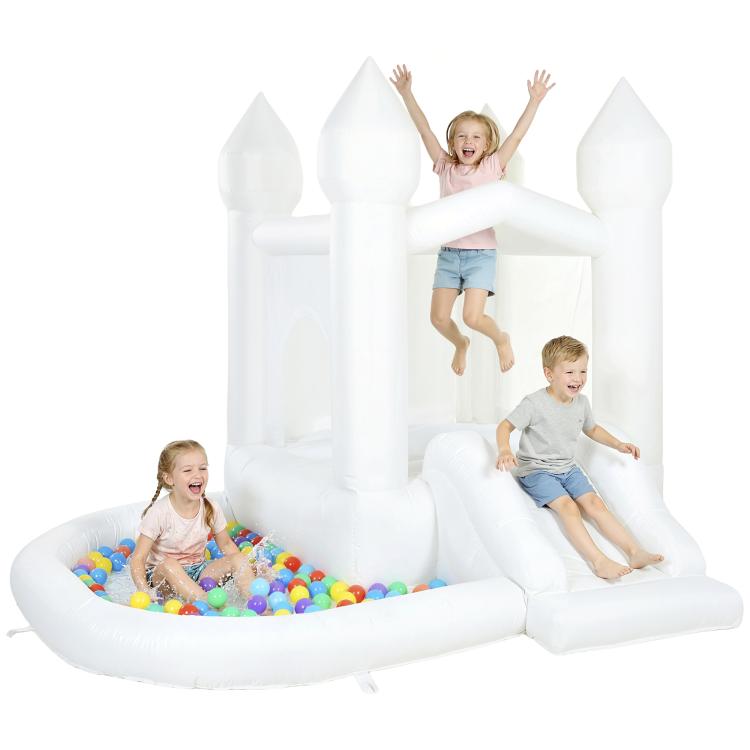 White inflatable castle bounce house with ball pit and slide; kids climbing through arch