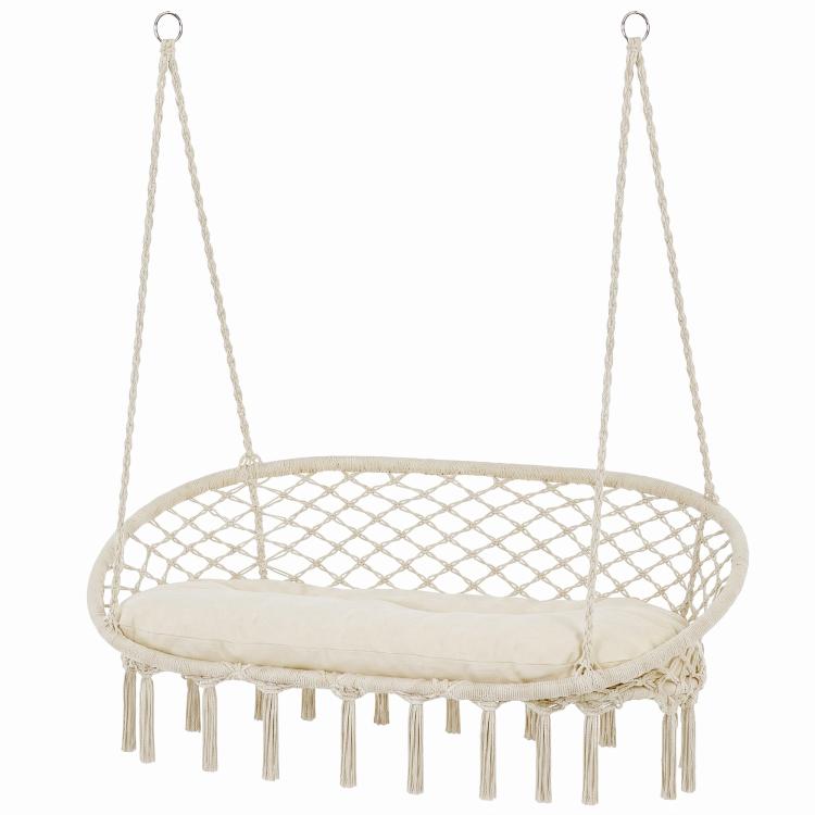 Round hanging macrame swing chair with cream cushion and long fringe tassels