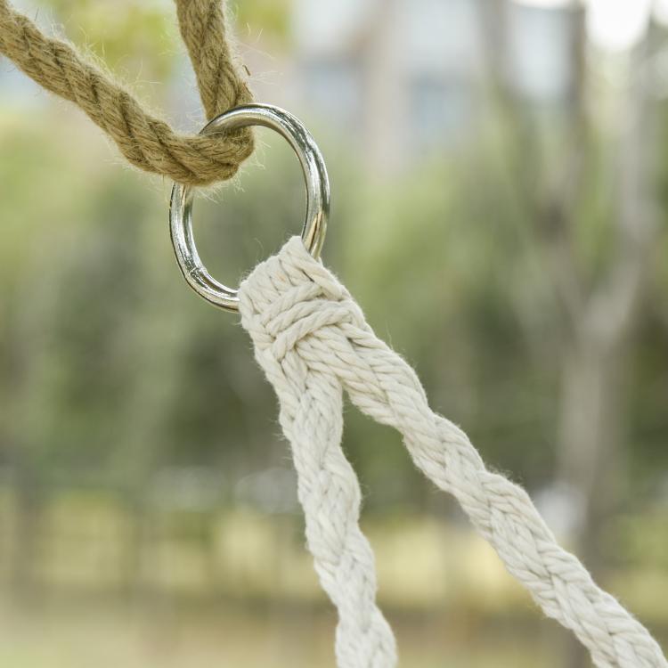 Close-up of hanging rope loop and braided cotton strand for macrame hammock chair