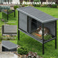 Outdoor rabbit hutch with ribbed PVC roof, wire front enclosure, and steel frame
