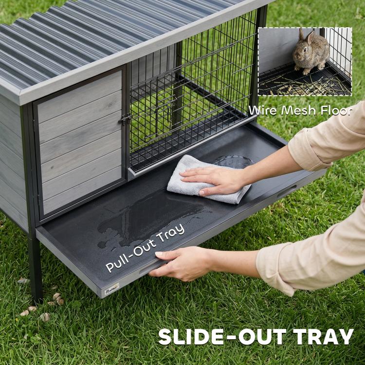 Rabbit hutch with pull-out tray opened and wire mesh floor visible inside