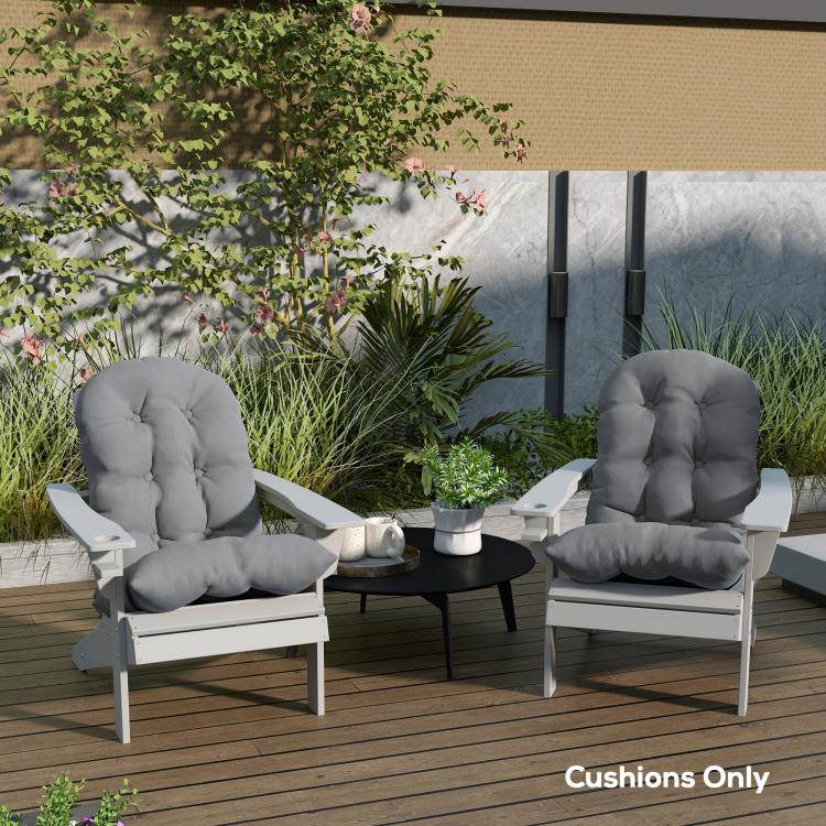 Gray tufted high-back patio chair cushions set on outdoor chairs, padded seat support