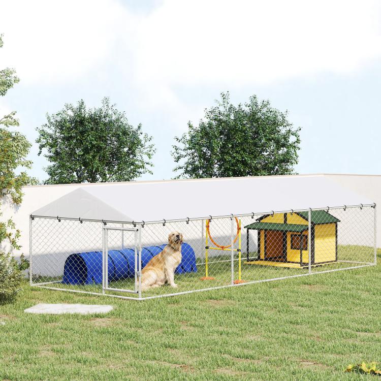 Outdoor dog kennel with dogs behind chain-link fence and white waterproof roof