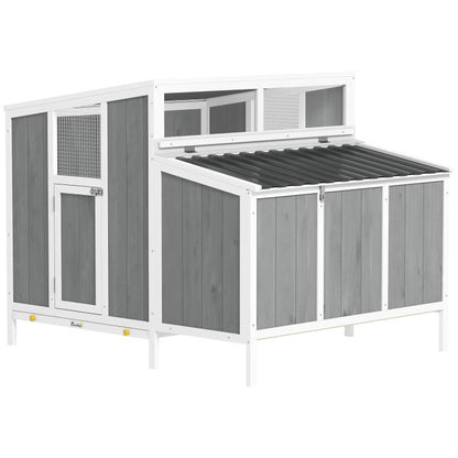 Wooden outdoor chicken coop with gray panel walls, white frame, and ventilated openings