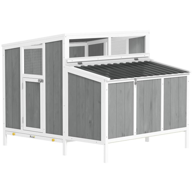 White and gray wooden chicken coop with wire mesh panels and nesting box