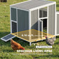 Wooden chicken coop with raised base platform and sloped roof overhang