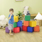 Multi-color foam cube blocks with two children playing near a stacked structure