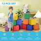 Child playing beside stacked colorful foam cube blocks in an indoor 12-piece set
