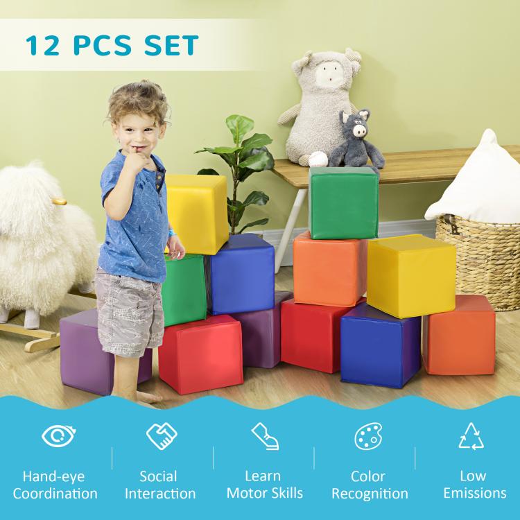 Child playing beside stacked colorful foam cube blocks in an indoor 12-piece set