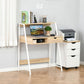 Natural wood desk with two open shelves, wide drawer, and white metal-style legs