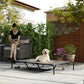 Gray elevated dog bed with black metal frame and mesh sleeping surface, with dog lying