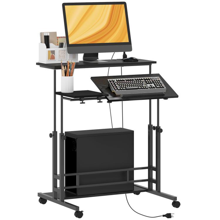 Black mobile standing desk with tilting tabletop, keyboard tray, lower shelf, and wheels.