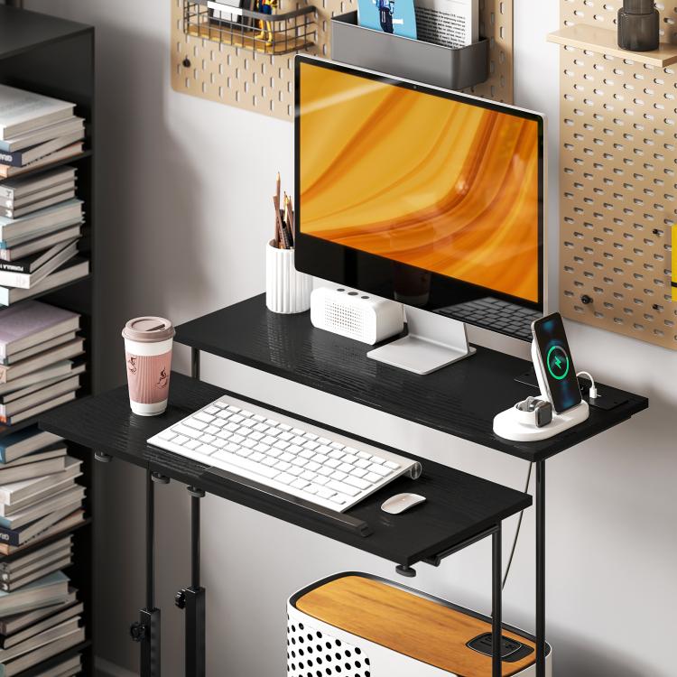 Black adjustable standing desk with tiltable tabletop and caster wheels