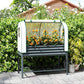 Raised metal garden bed with clear greenhouse cover and mesh end panels, filled with flowers